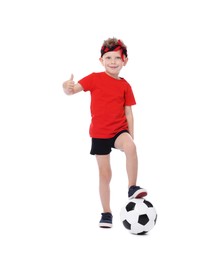 Photo of Little boy with soccer ball showing thumbs up on white background