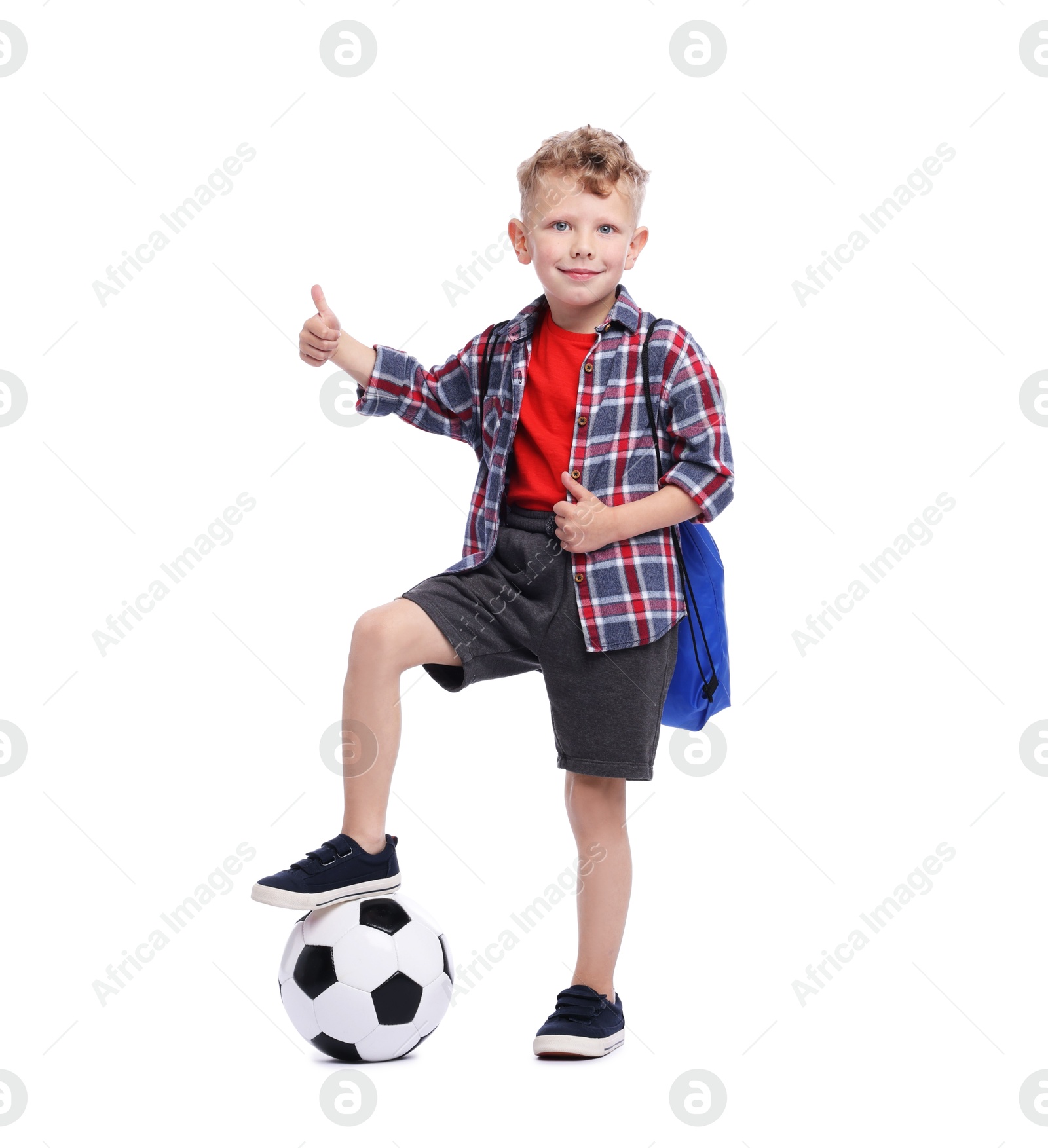 Little boy with soccer ball and sports string bag showing thumbs up on white background Photo of Little boy with soccer ball and sports string bag showing thumbs up on white background