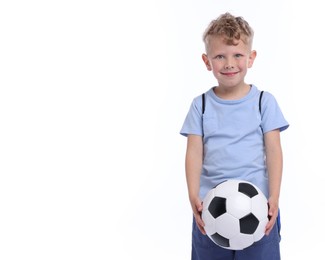 Photo of Little boy with soccer ball on white background, space for text