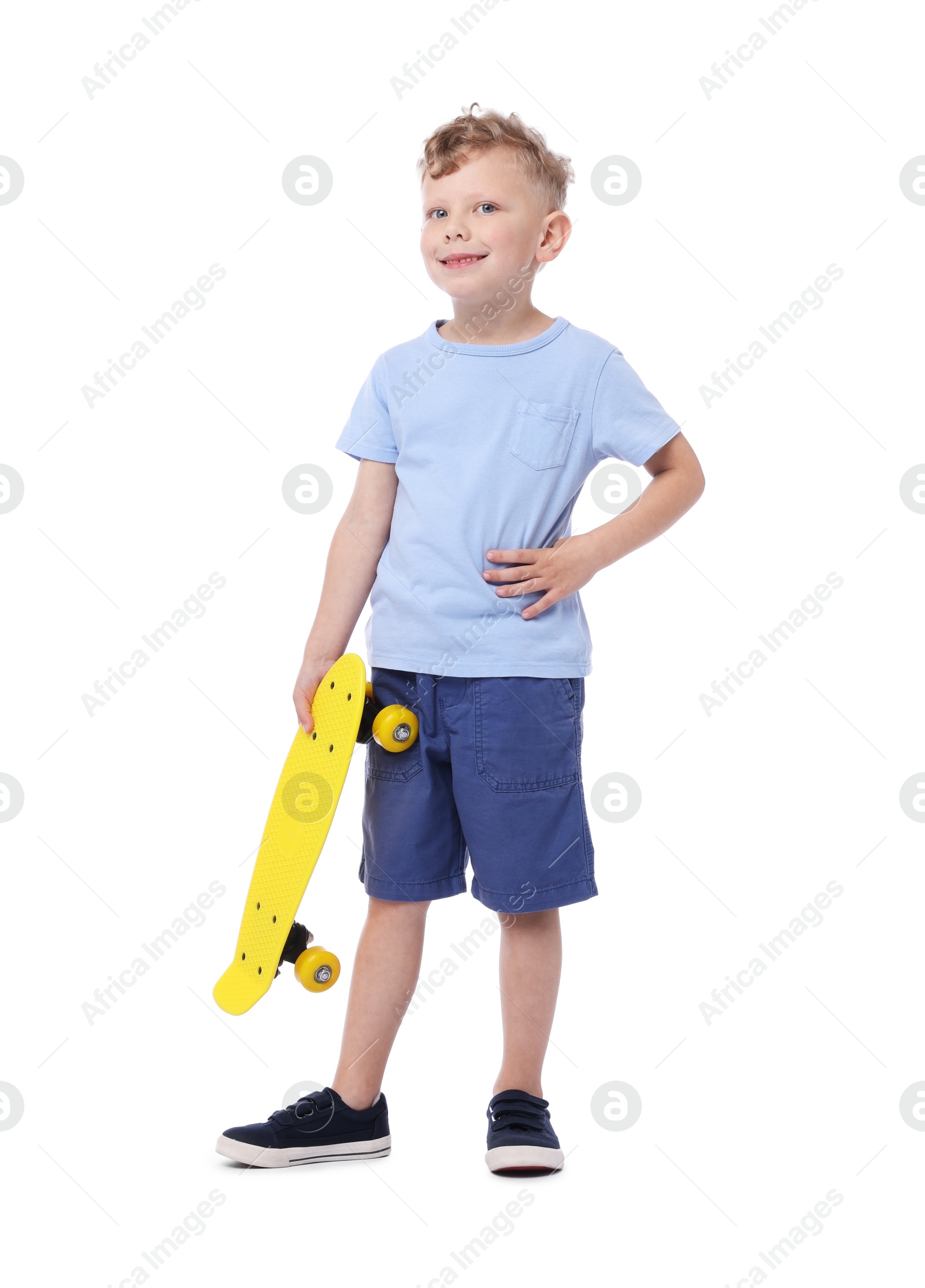 Little boy with penny board on white background Photo of Little boy with penny board on white background