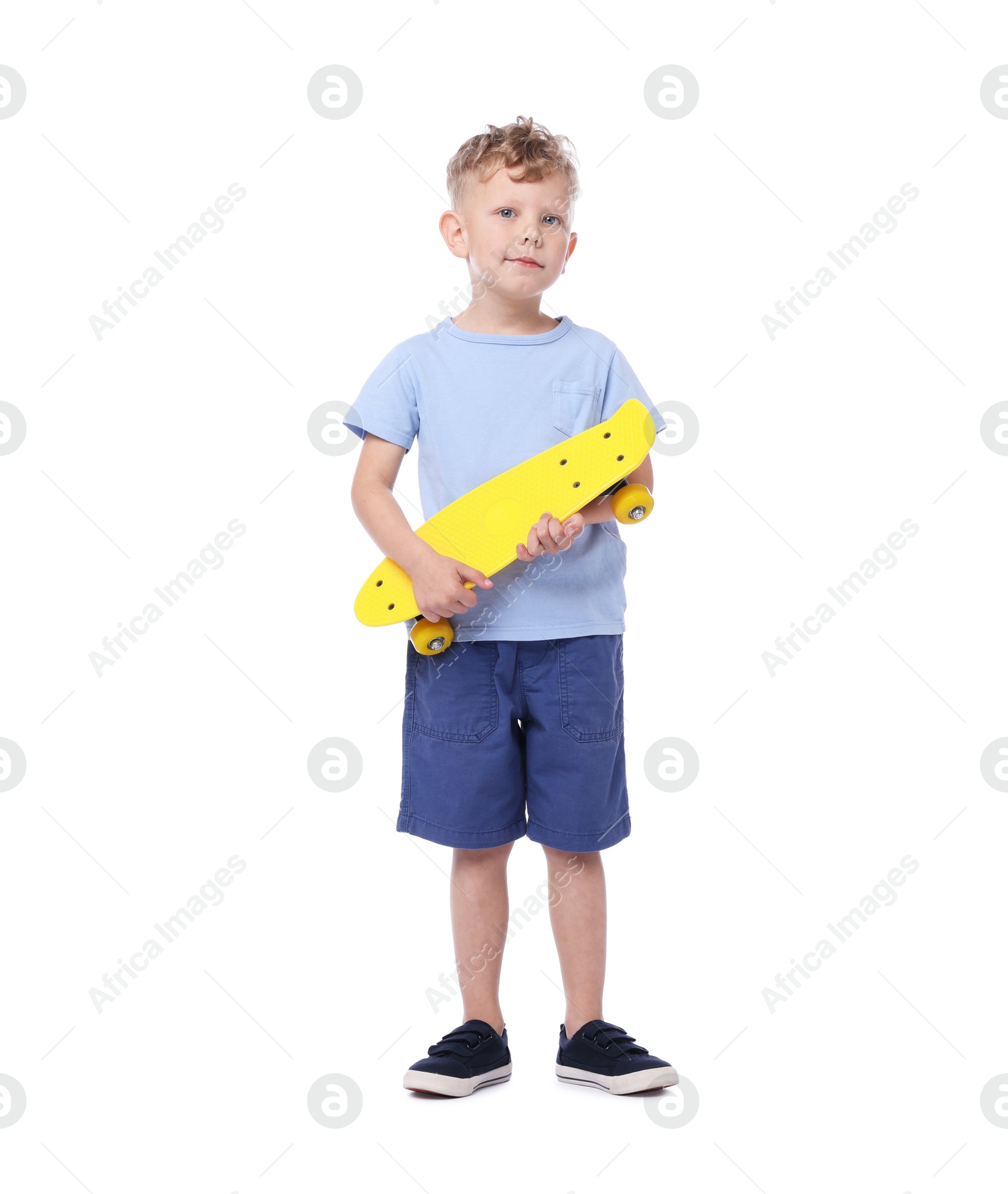 Little boy with penny board on white background Photo of Little boy with penny board on white background