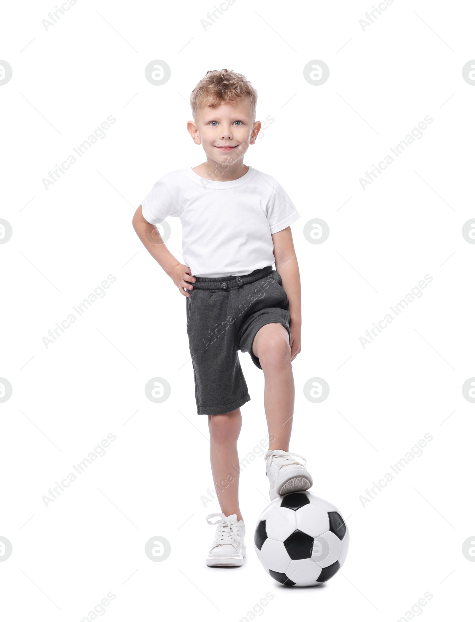 Little boy with soccer ball on white background Photo of Little boy with soccer ball on white background