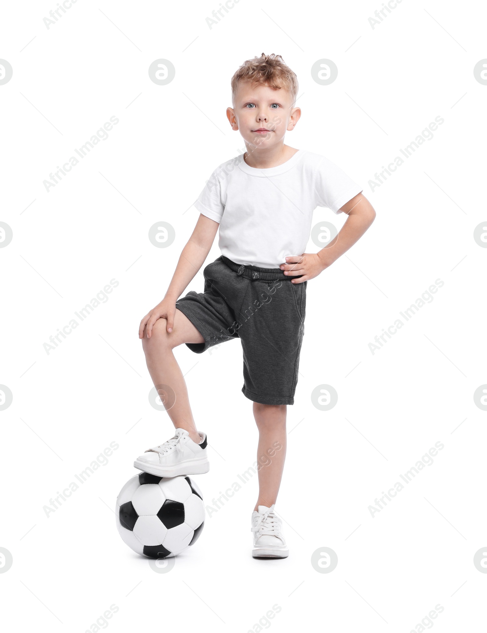Little boy with soccer ball on white background Photo of Little boy with soccer ball on white background