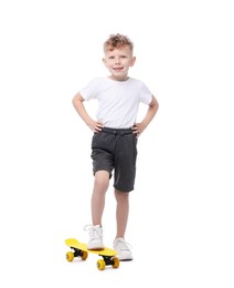 Photo of Little boy with penny board on white background