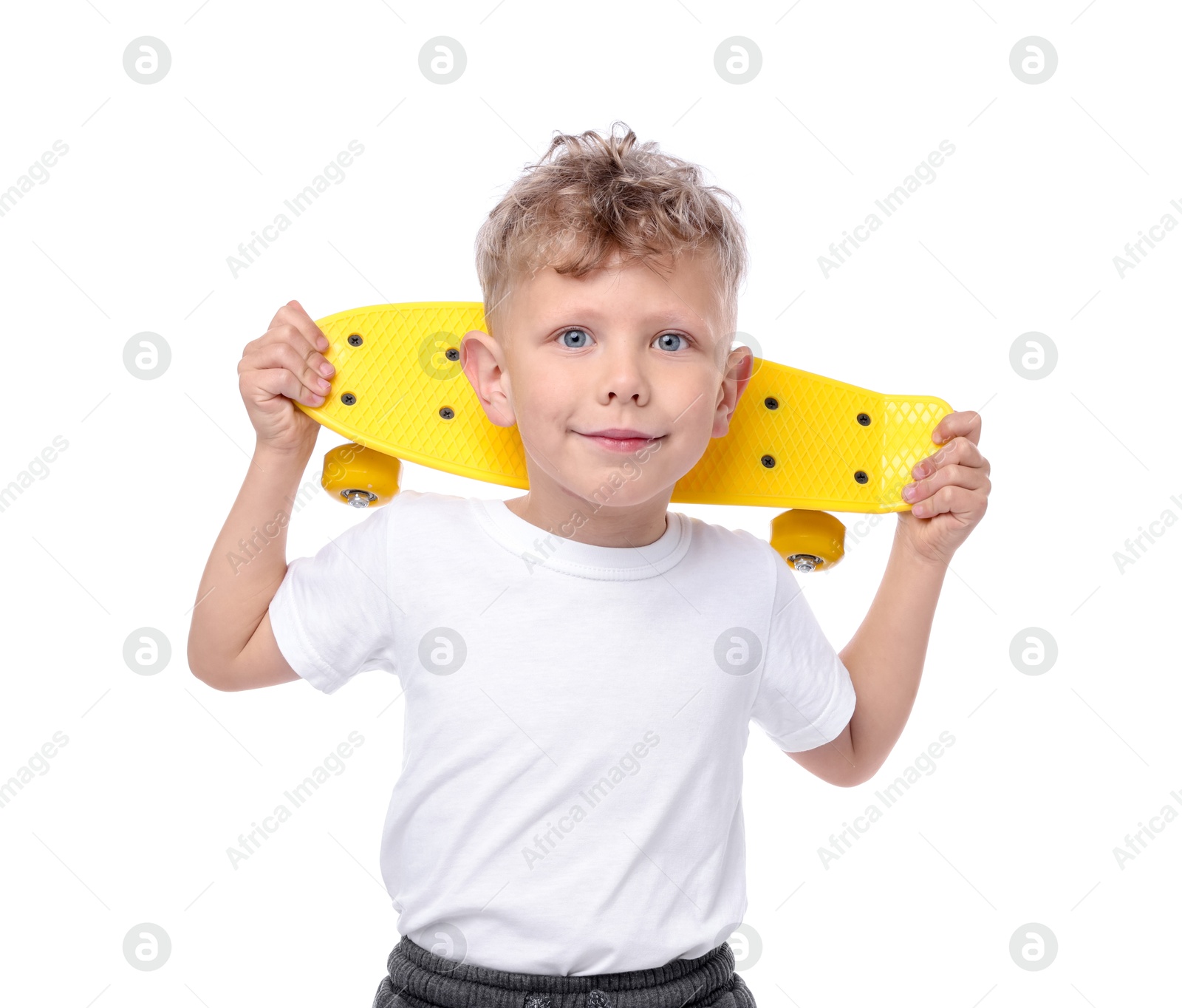Little boy with penny board on white background Photo of Little boy with penny board on white background
