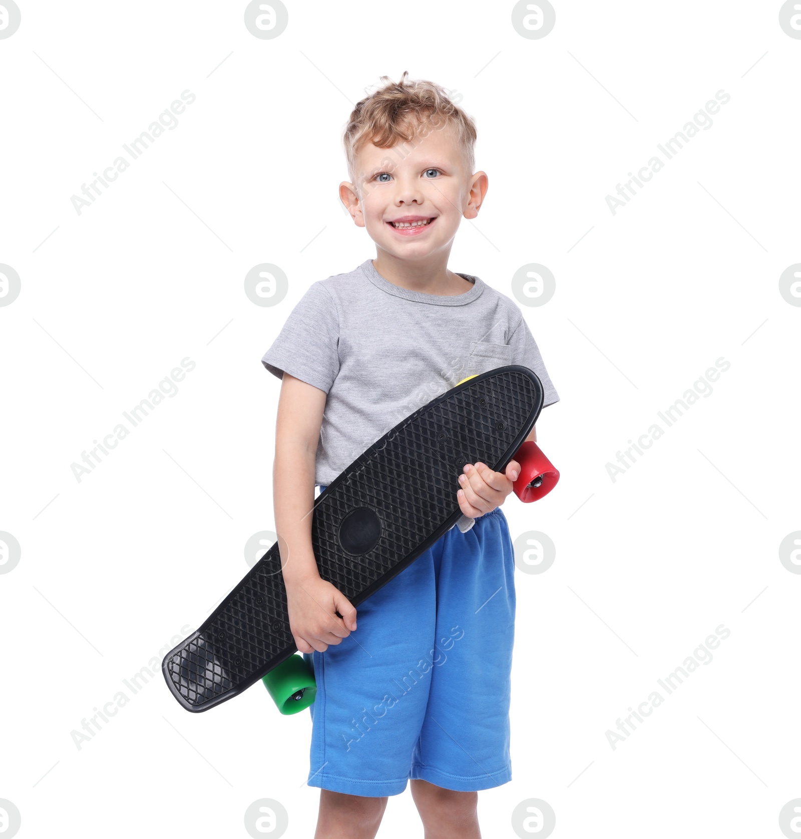 Little boy with penny board on white background Photo of Little boy with penny board on white background