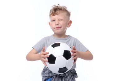 Photo of Little boy with soccer ball on white background