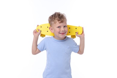 Photo of Little boy with penny board on white background