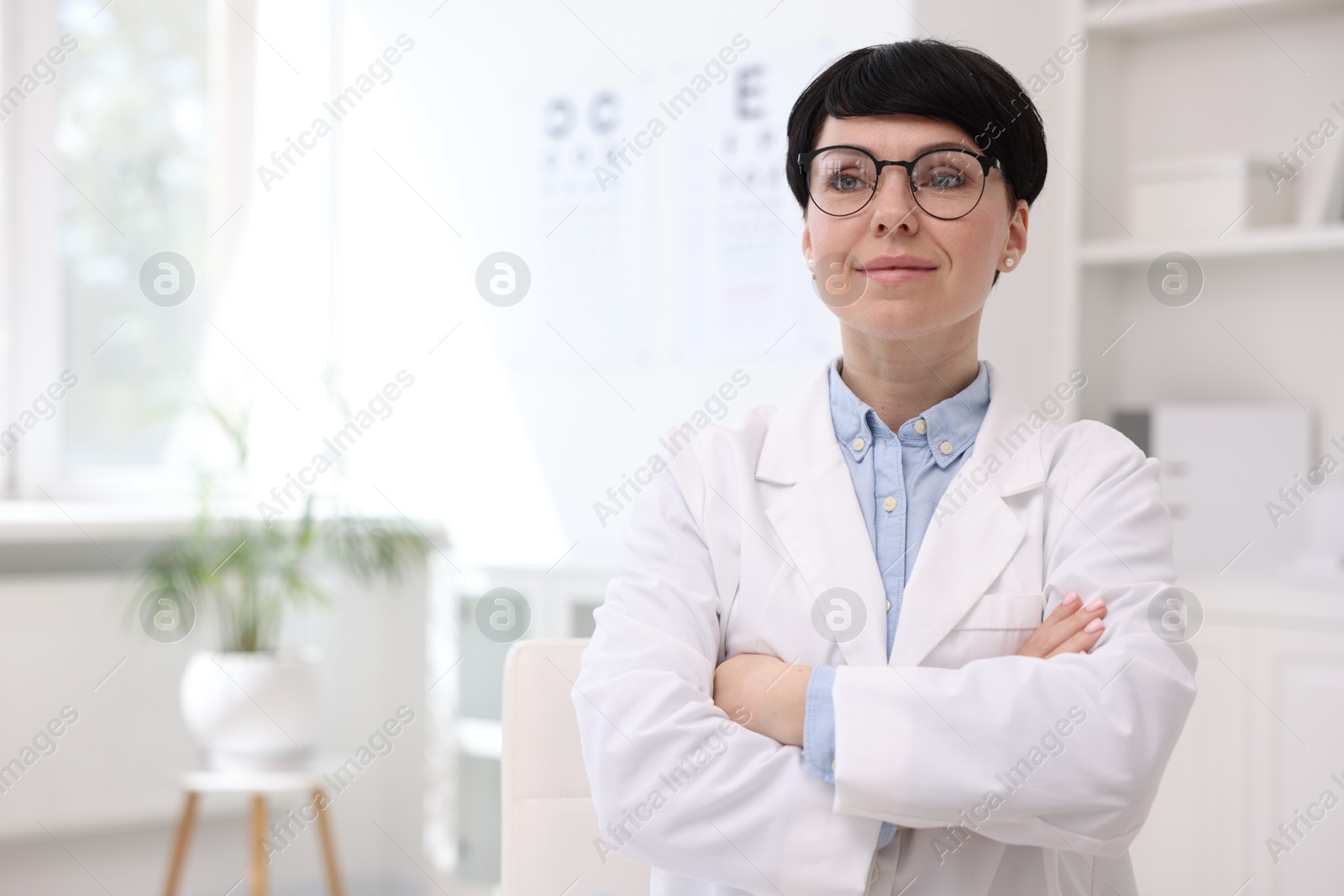 Portrait of professional ophthalmologist in clinic, space for text Photo of Portrait of professional ophthalmologist in clinic, space for text