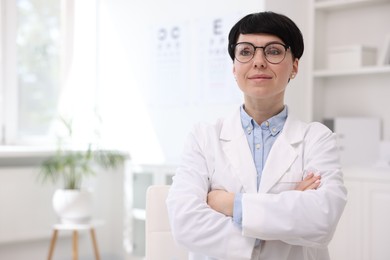 Photo of Portrait of professional ophthalmologist in clinic, space for text