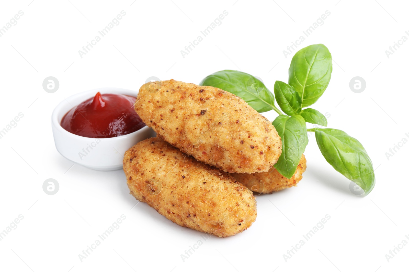 Tasty fried croquettes, basil and sauce isolated on white Photo of Tasty fried croquettes, basil and sauce isolated on white