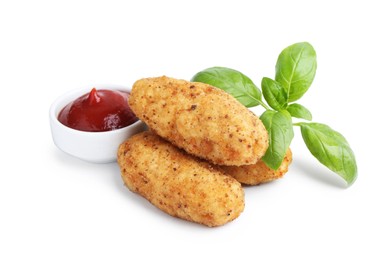 Photo of Tasty fried croquettes, basil and sauce isolated on white