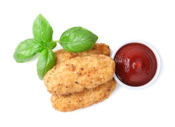 Photo of Tasty fried croquettes, basil and sauce isolated on white, top view