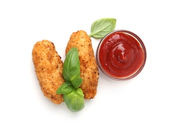 Photo of Tasty fried croquettes, basil and sauce isolated on white, top view