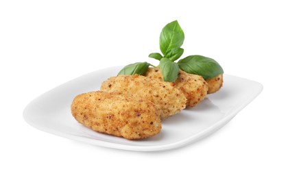 Photo of Tasty fried croquettes and basil isolated on white