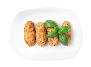 Photo of Tasty fried croquettes and basil isolated on white, top view