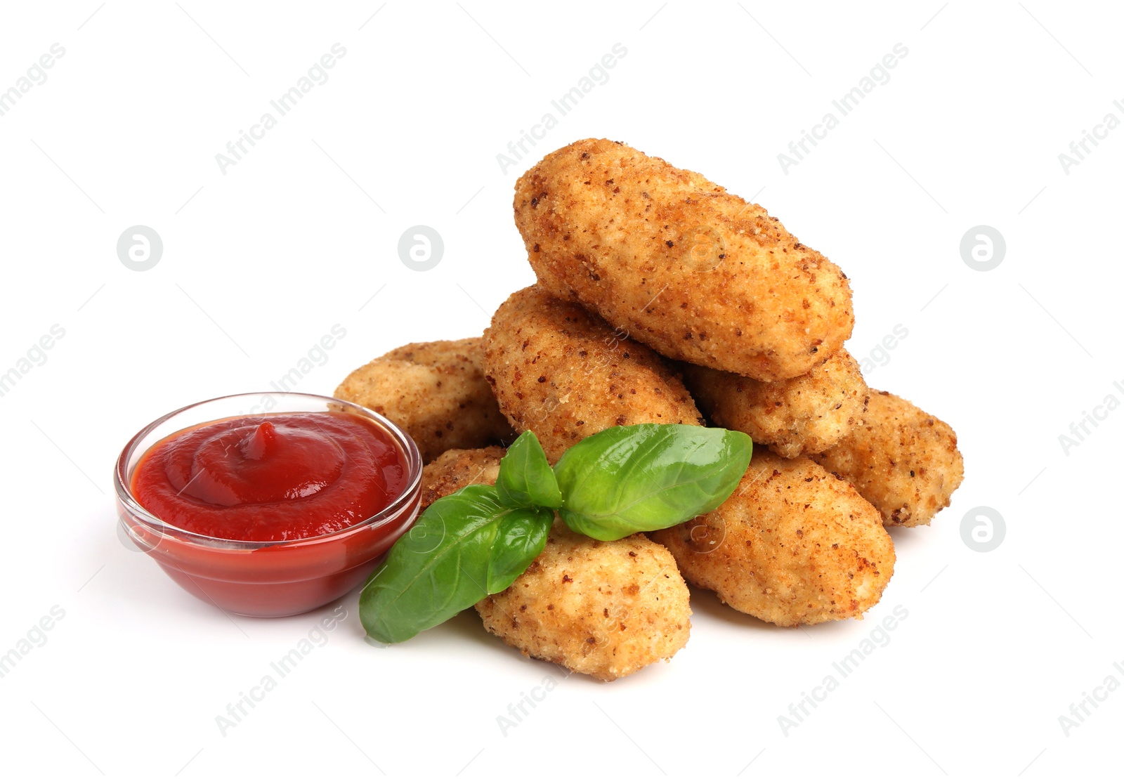 Tasty fried croquettes, basil and sauce isolated on white Photo of Tasty fried croquettes, basil and sauce isolated on white