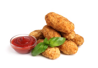 Photo of Tasty fried croquettes, basil and sauce isolated on white