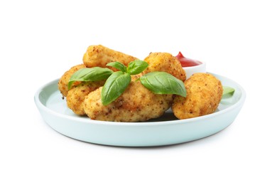 Photo of Tasty fried croquettes, basil and sauce isolated on white