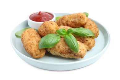 Photo of Tasty fried croquettes, basil and sauce isolated on white