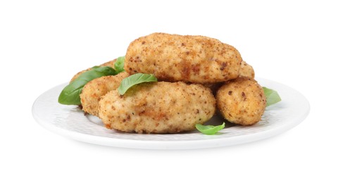 Photo of Tasty fried croquettes and basil isolated on white