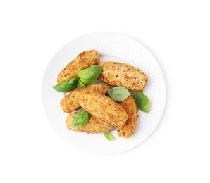 Photo of Tasty fried croquettes and basil isolated on white, top view