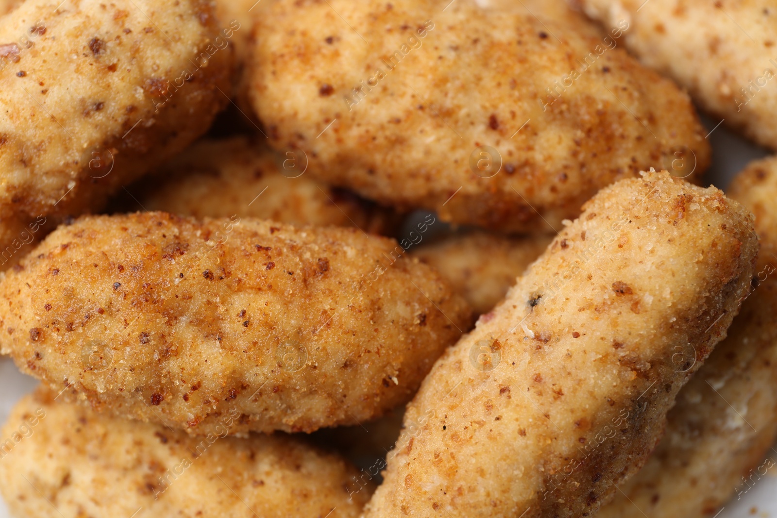 Tasty fried croquettes as background, closeup view Photo of Tasty fried croquettes as background, closeup view
