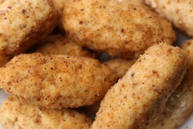 Photo of Tasty fried croquettes as background, closeup view