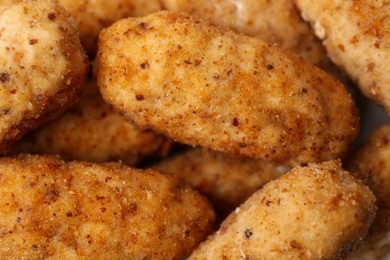 Photo of Tasty fried croquettes as background, closeup view