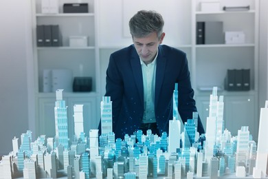 Illustration of Building information modelling. Man using holographic projection of city in office