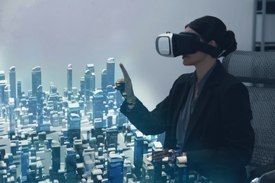Illustration of Building information modelling. Woman using virtual reality headset in office. holographic projection of city