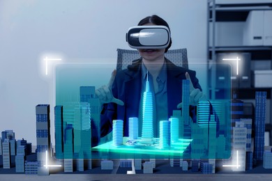 Illustration of Building information modelling. Woman using virtual reality headset in office. holographic projection of city