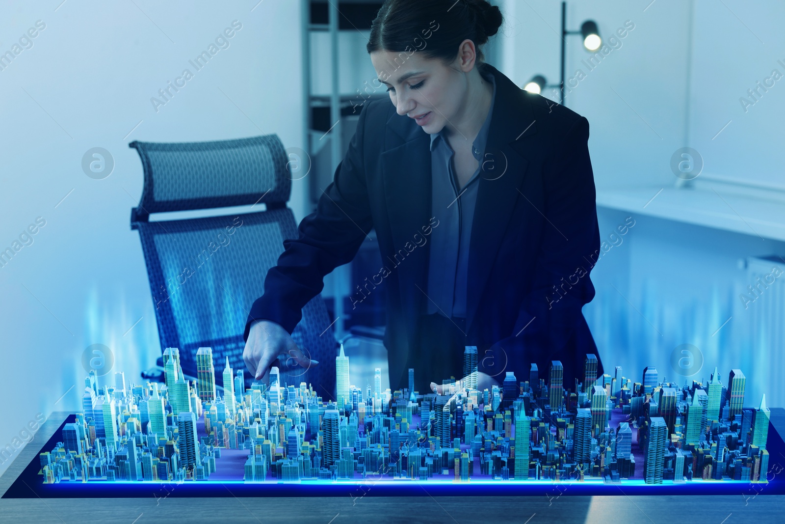 Building information modelling. Woman using holographic projection of city in office Illustration of Building information modelling. Woman using holographic projection of city in office