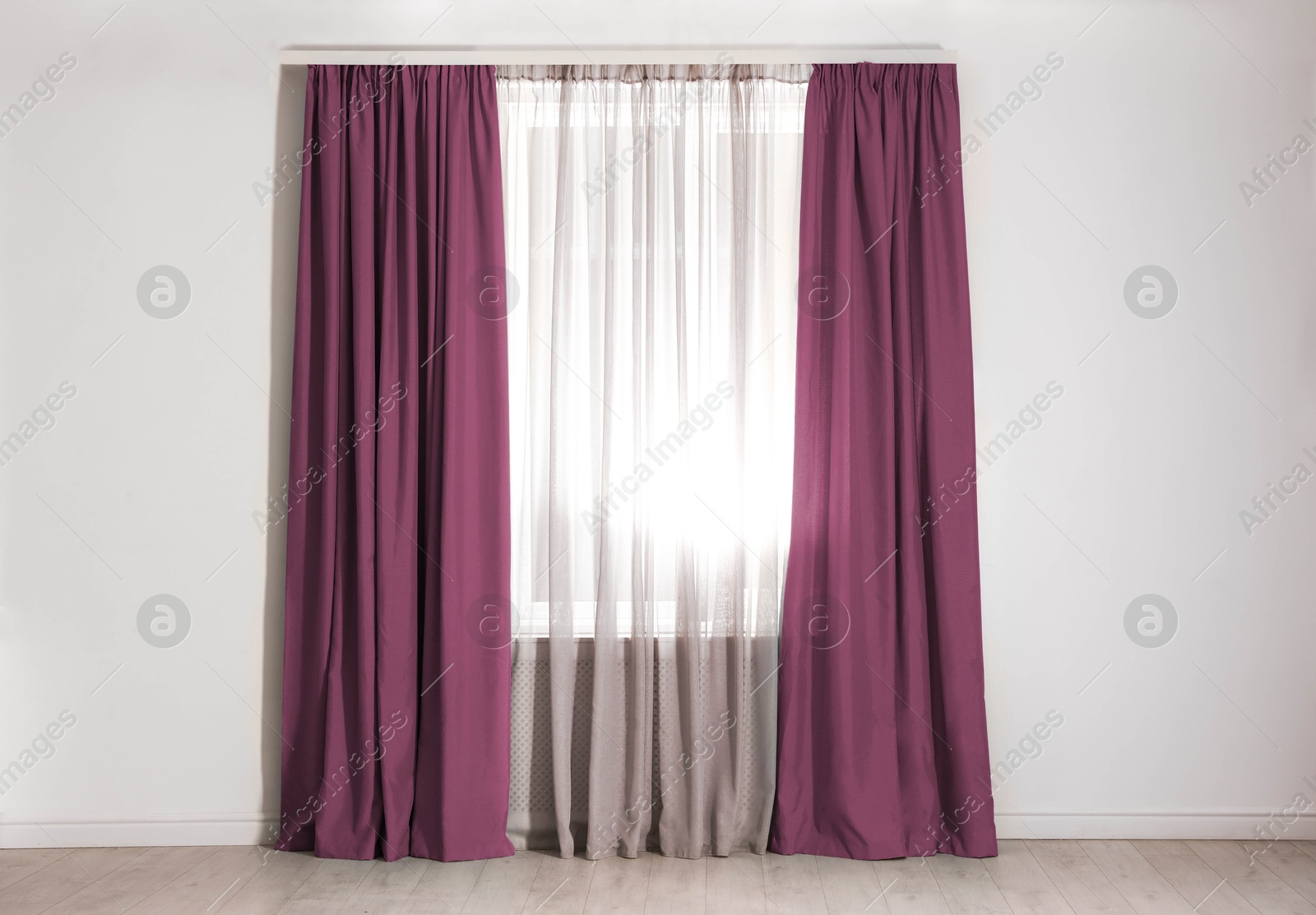 Window with red purple curtains in room. Interior design Image of Window with red purple curtains in room. Interior design