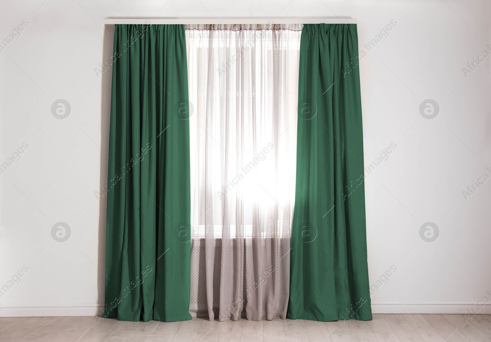 Window with green curtains in room. Interior design Image of Window with green curtains in room. Interior design