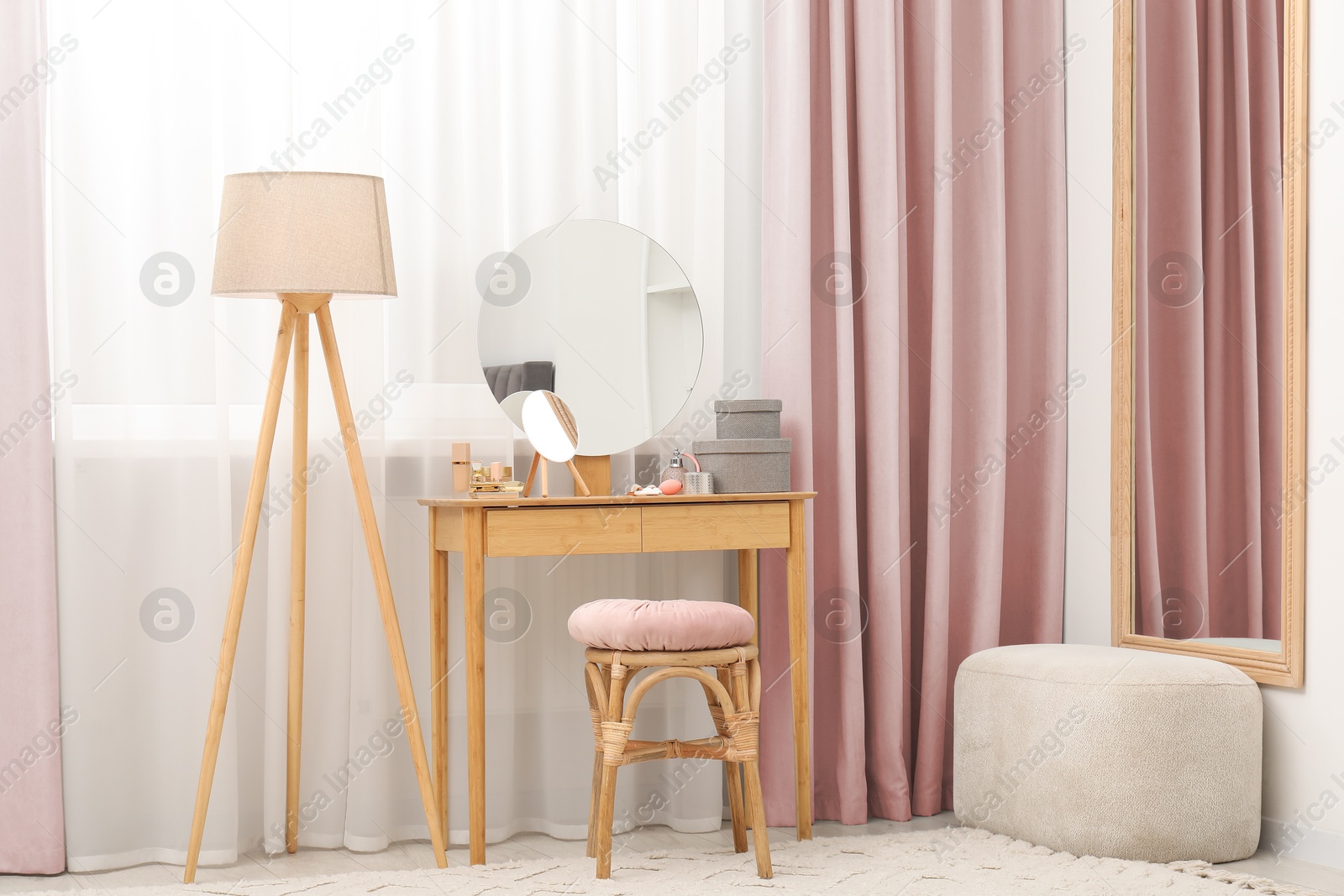Mirrors, dressing table, lamp and stool near window with pink beige curtains in room. Interior design Image of Mirrors, dressing table, lamp and stool near window with pink beige curtains in room. Interior design