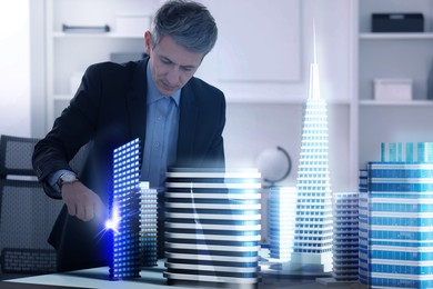 Illustration of Building information modelling. Man using holographic projection of city in office