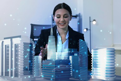 Illustration of Building information modelling. Woman using holographic projection of city in office