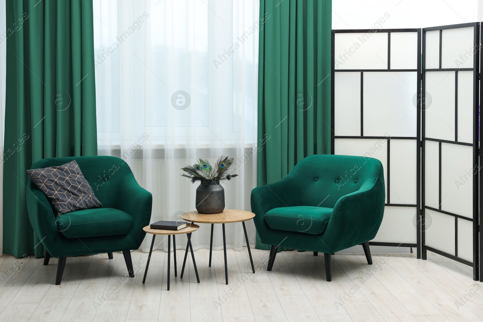 Living room with green armchairs and curtains. Interior design Image of Living room with green armchairs and curtains. Interior design