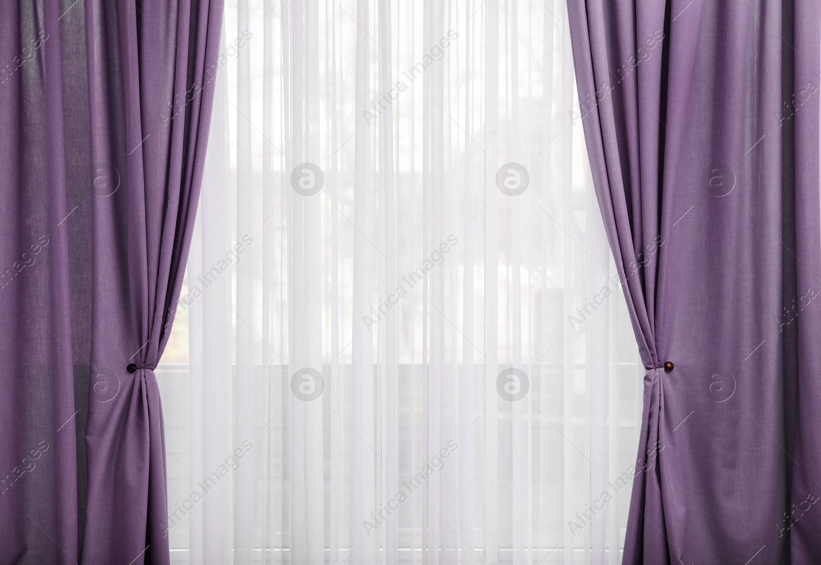 Window with beautiful purple curtains. Interior design Image of Window with beautiful purple curtains. Interior design