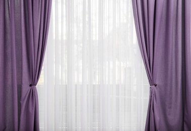 Image of Window with beautiful purple curtains. Interior design