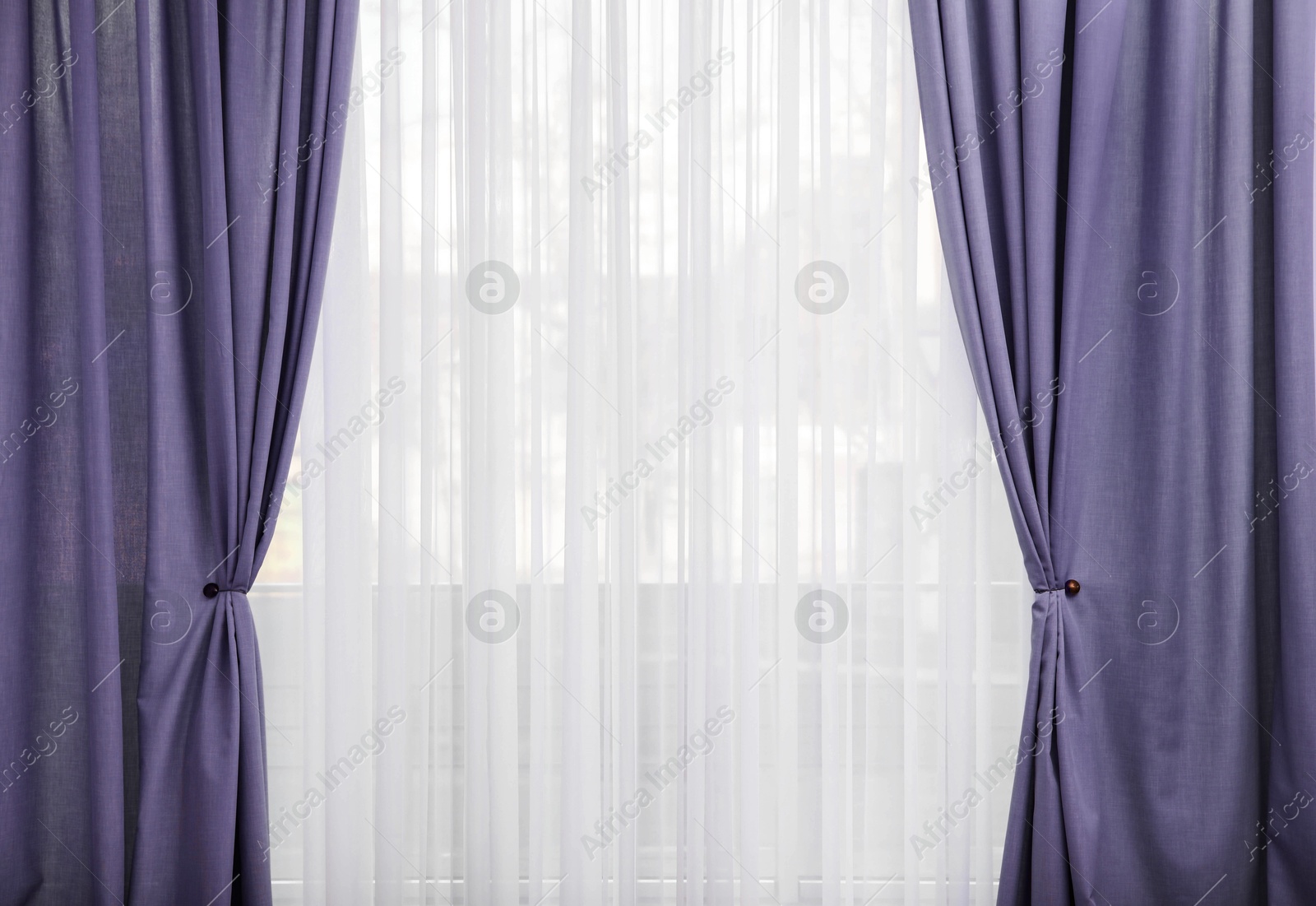 Window with beautiful violet blue curtains. Interior design Image of Window with beautiful violet blue curtains. Interior design