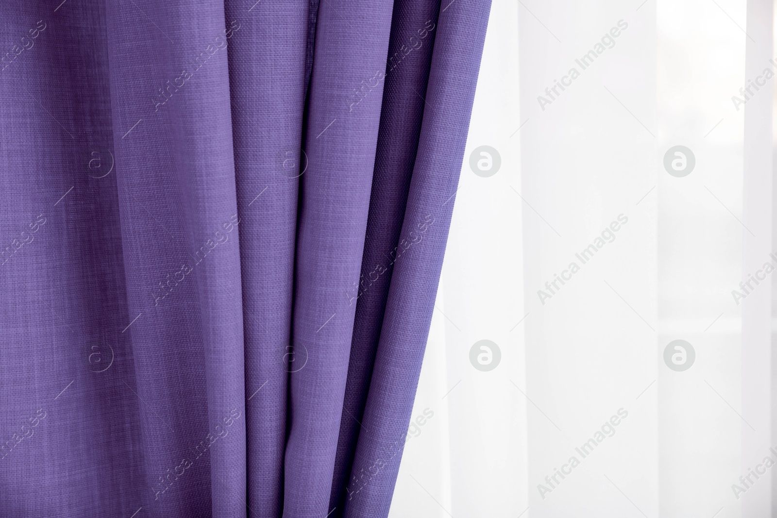 Window with beautiful violet blue curtains. Interior design Image of Window with beautiful violet blue curtains. Interior design