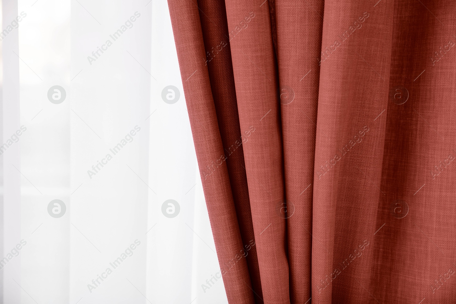 Window with beautiful dark red curtains. Interior design Image of Window with beautiful dark red curtains. Interior design