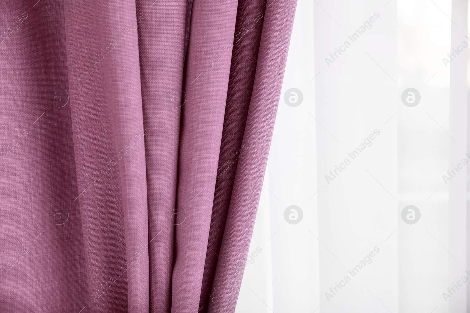 Window with beautiful pink curtains. Interior design Image of Window with beautiful pink curtains. Interior design