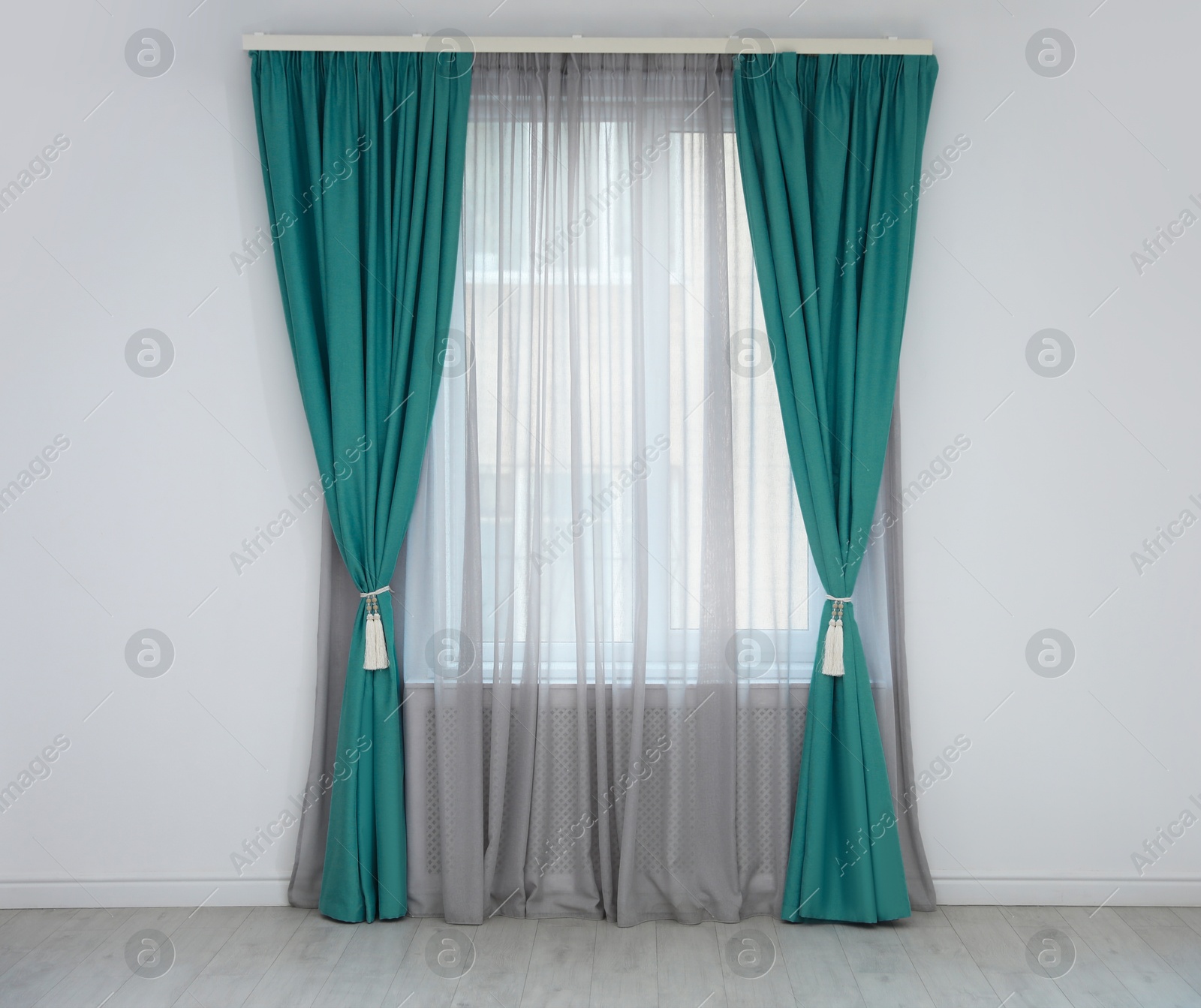 Window with teal curtains in room. Interior design Image of Window with teal curtains in room. Interior design