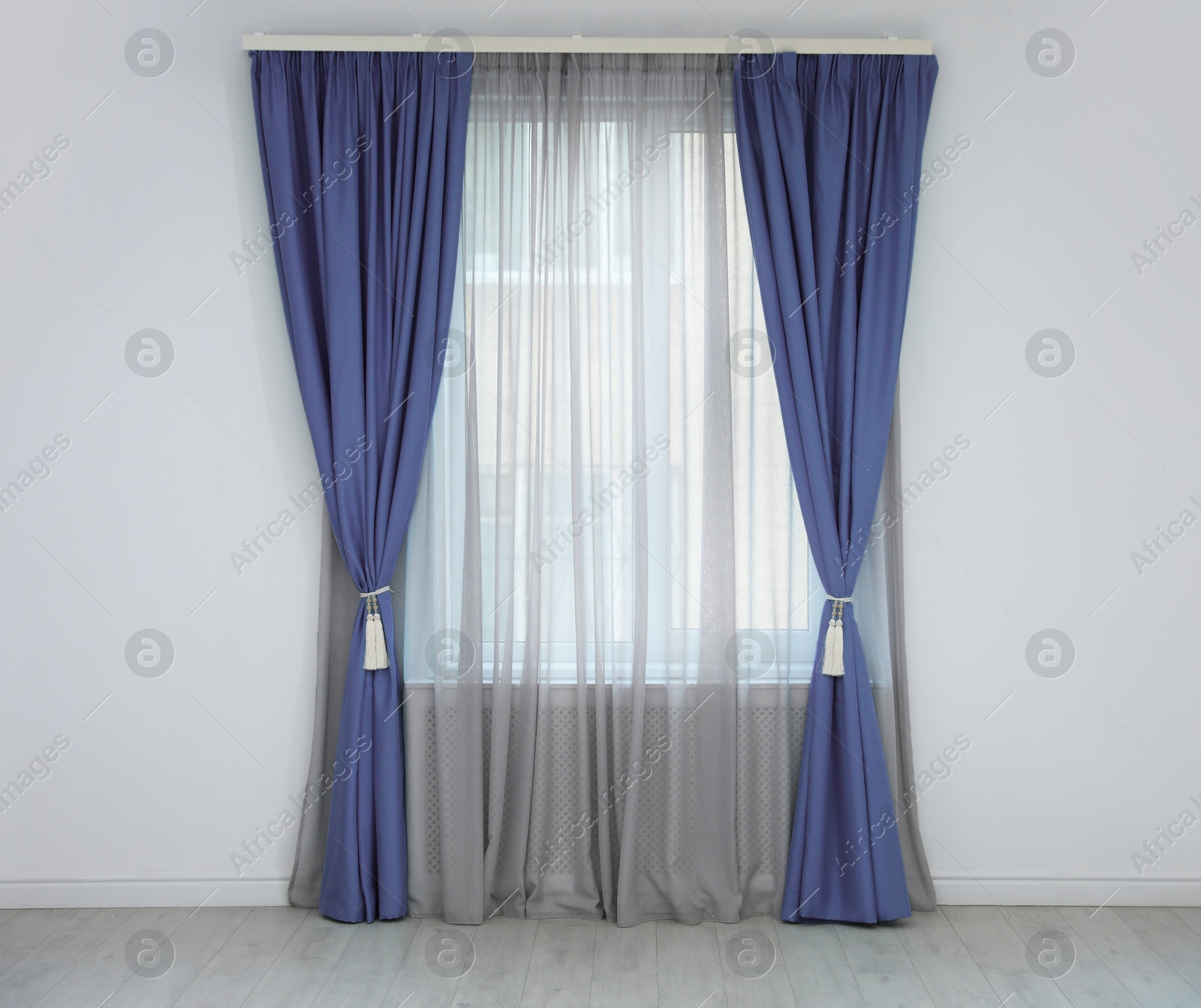Window with blue curtains in room. Interior design Image of Window with blue curtains in room. Interior design