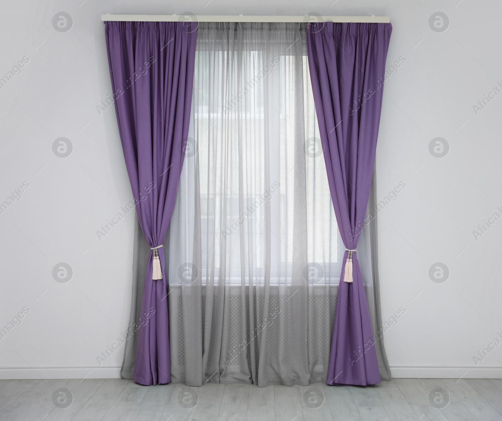 Window with purple curtains in room. Interior design Image of Window with purple curtains in room. Interior design