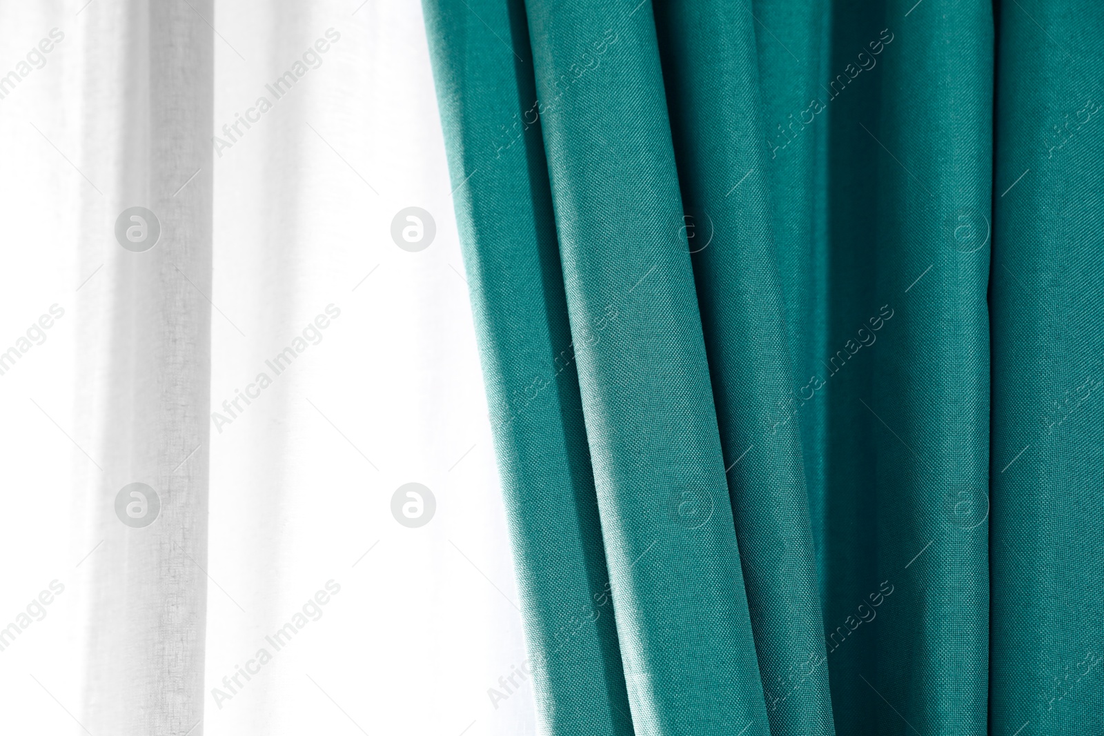 Window with beautiful teal curtains. Interior design Image of Window with beautiful teal curtains. Interior design