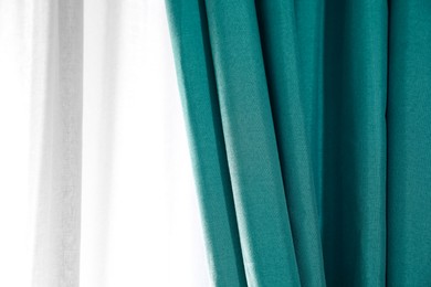 Image of Window with beautiful teal curtains. Interior design